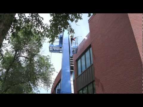 Construction Cleanup Using A 65 Foot Boom Lift.mov