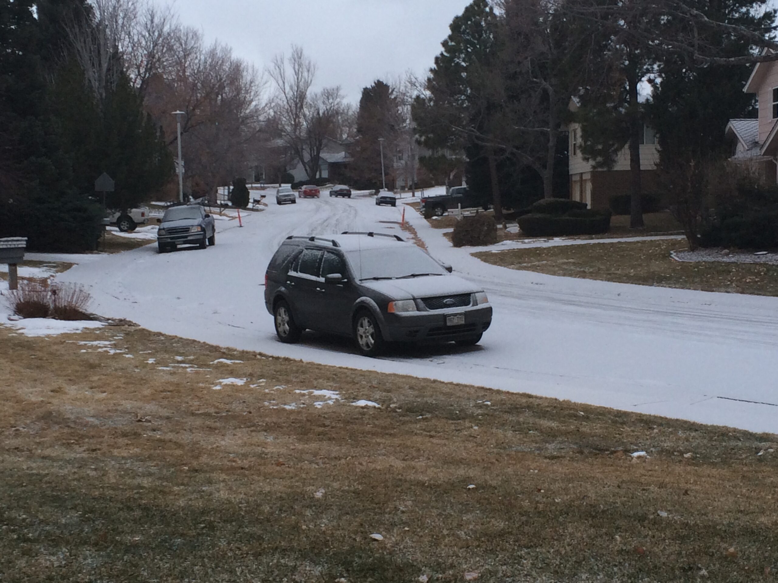 A car and street covered with snow in Colorado