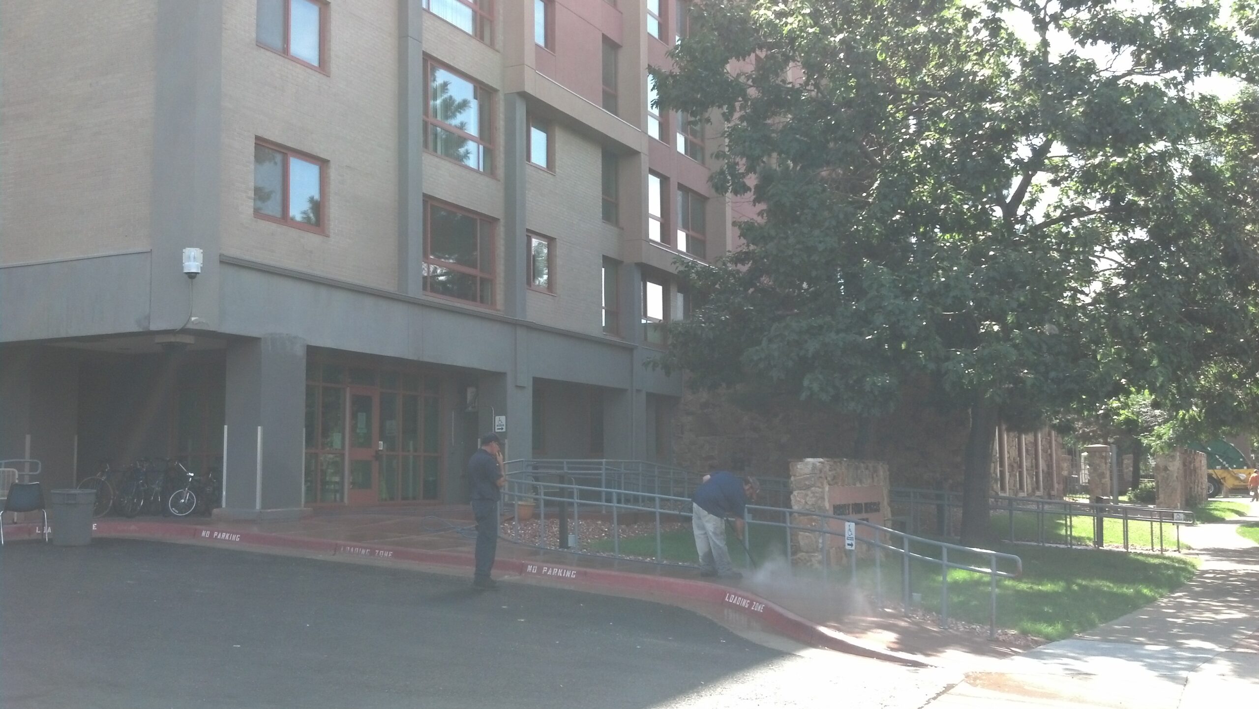 Pressure washing sidewalks for the Denver Housing Authority