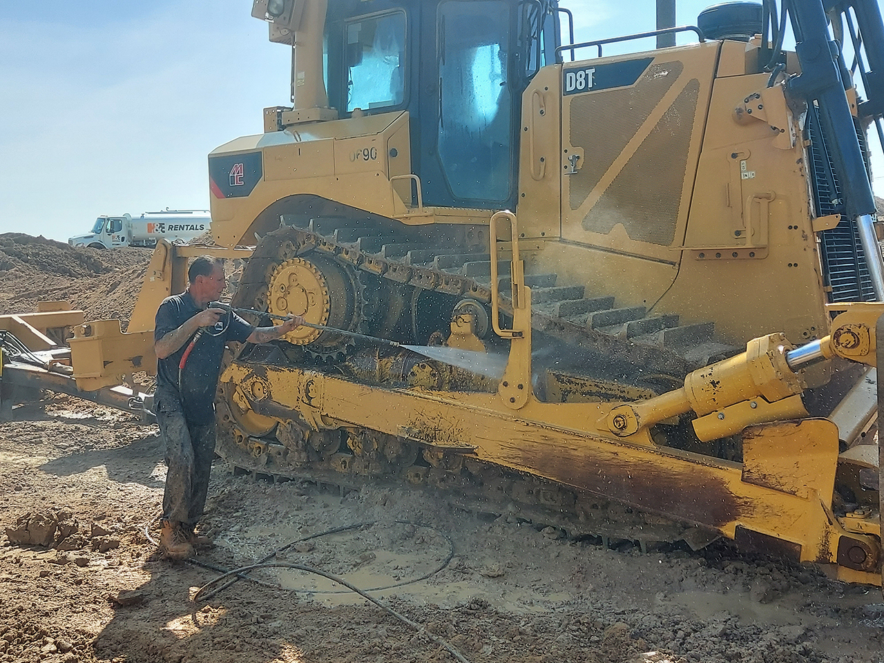 Pressure Washing a Bulldozer in Aurora, Colorado