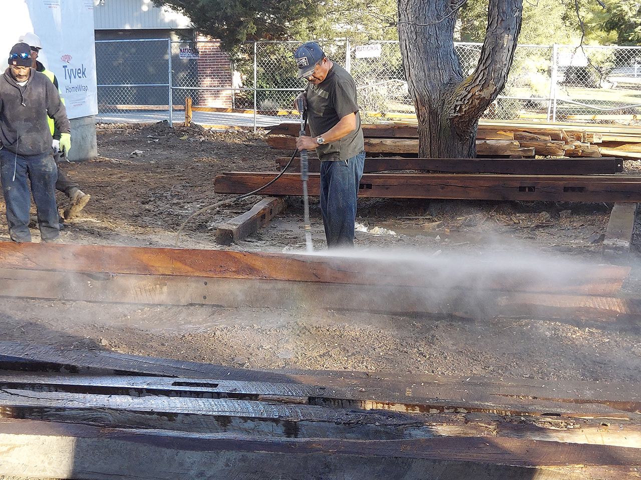 Pressure Washing Recycled Oak Beams in Lakewood, Colorado