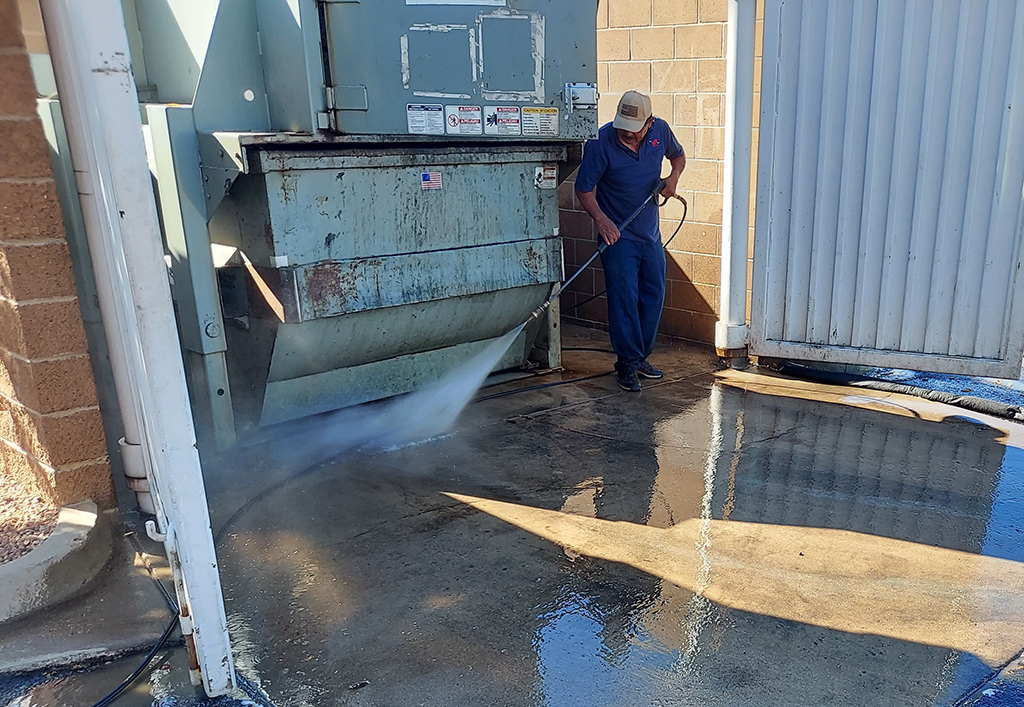 Pressure Washing a Dumpster Enclosure in Arvada, Colorado