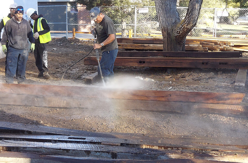 Pressure Washing Reclaimed Barn Wood for New Lakewood Home