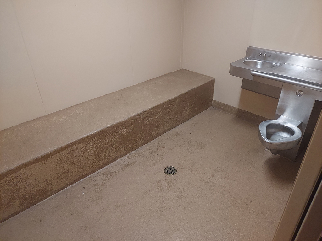 The holding cells at the Littleton, Colorado Police department are designed for functionality - not comfort.