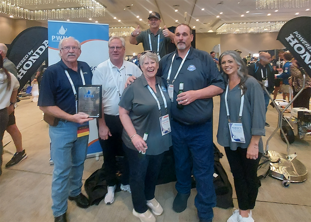 PWNA Conference Skid Win Celebrating Winning a Hot Water Skid at the PWNA Elevate Conference