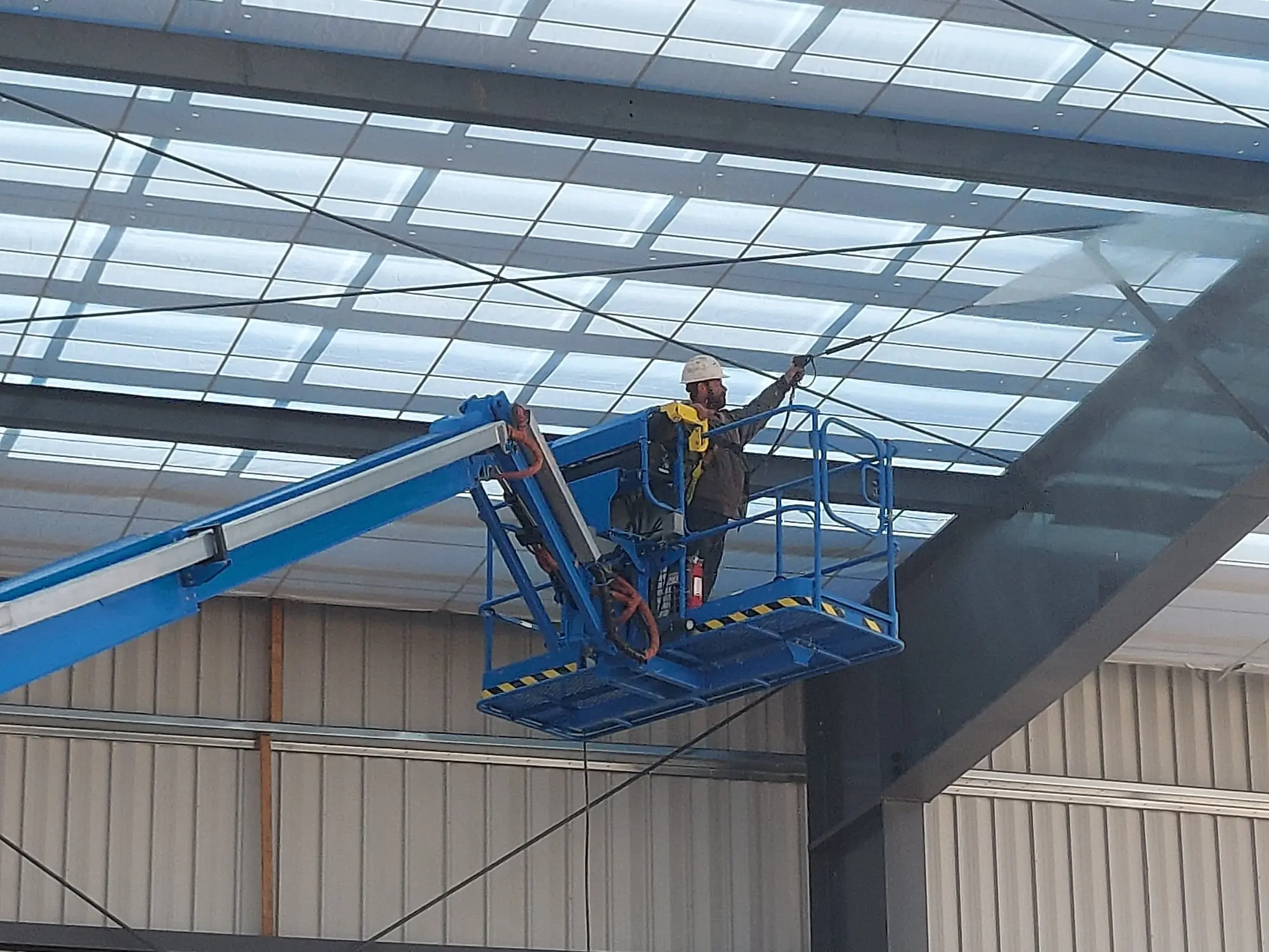 Centennial Airport 3 Cleaning dirt from the beams in a new airport hanger in Centennial, Colorado